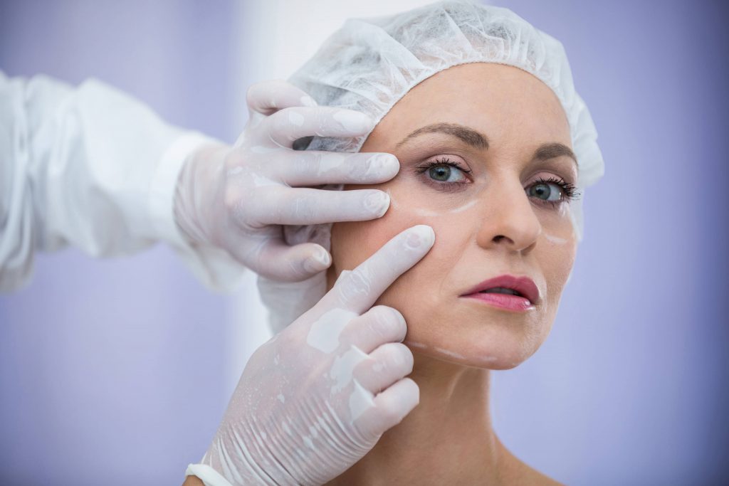 doctor-examining-female-patients-face-for-cosmetic-treatment (1)